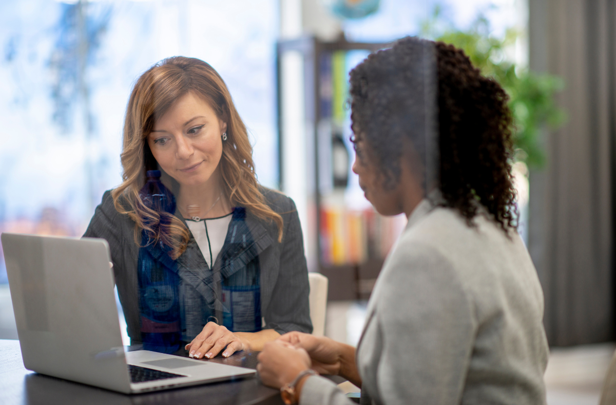 Untitled (1200 x 788 px) (18) Two women looking at a computer.