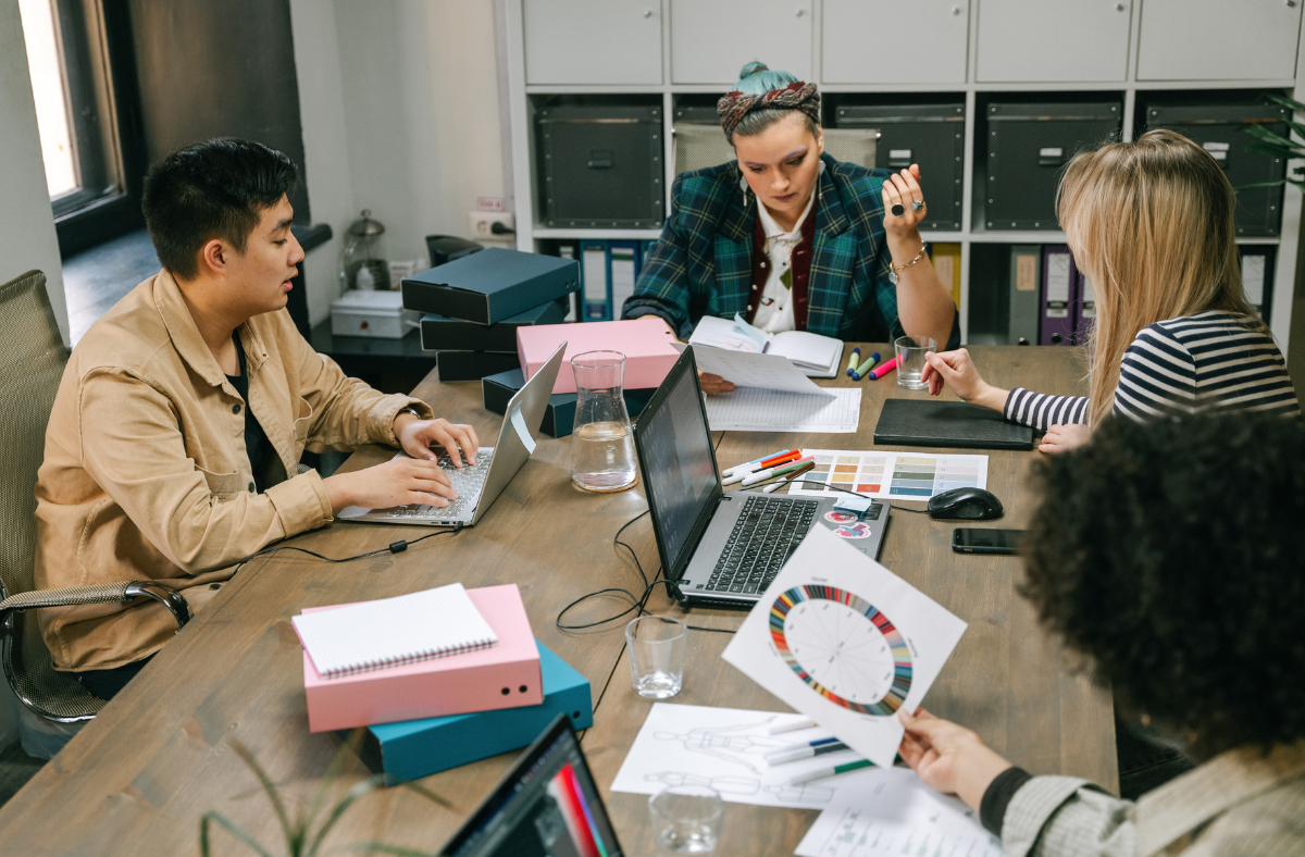 People working in an office, listening to a webinar.
