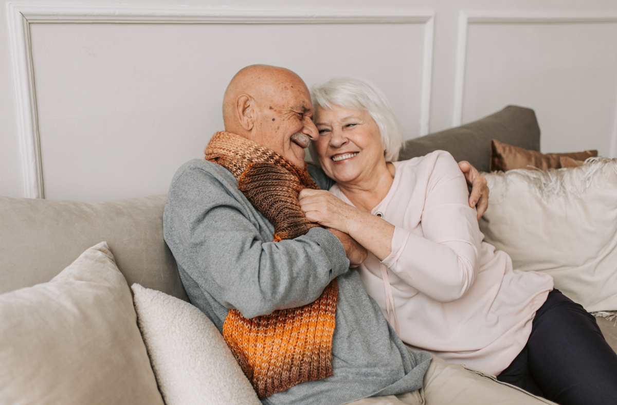 Two people smiling at each other.