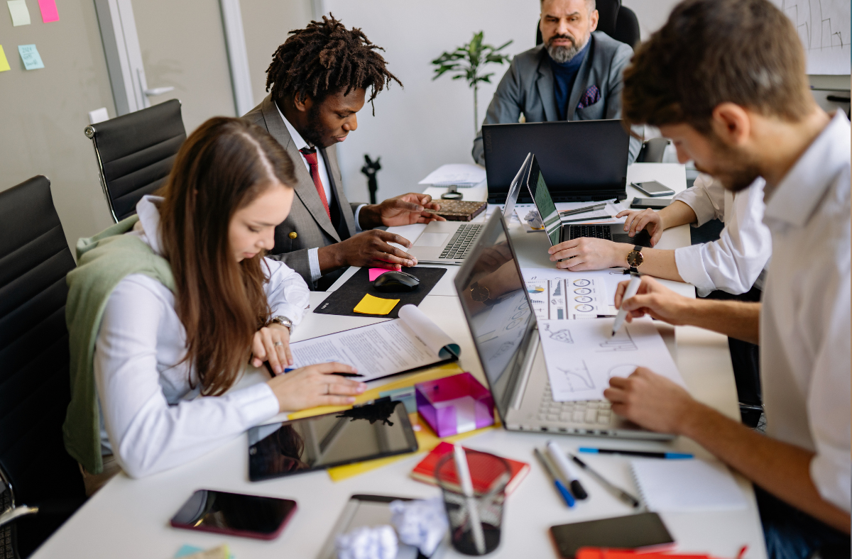 People working at a desk.