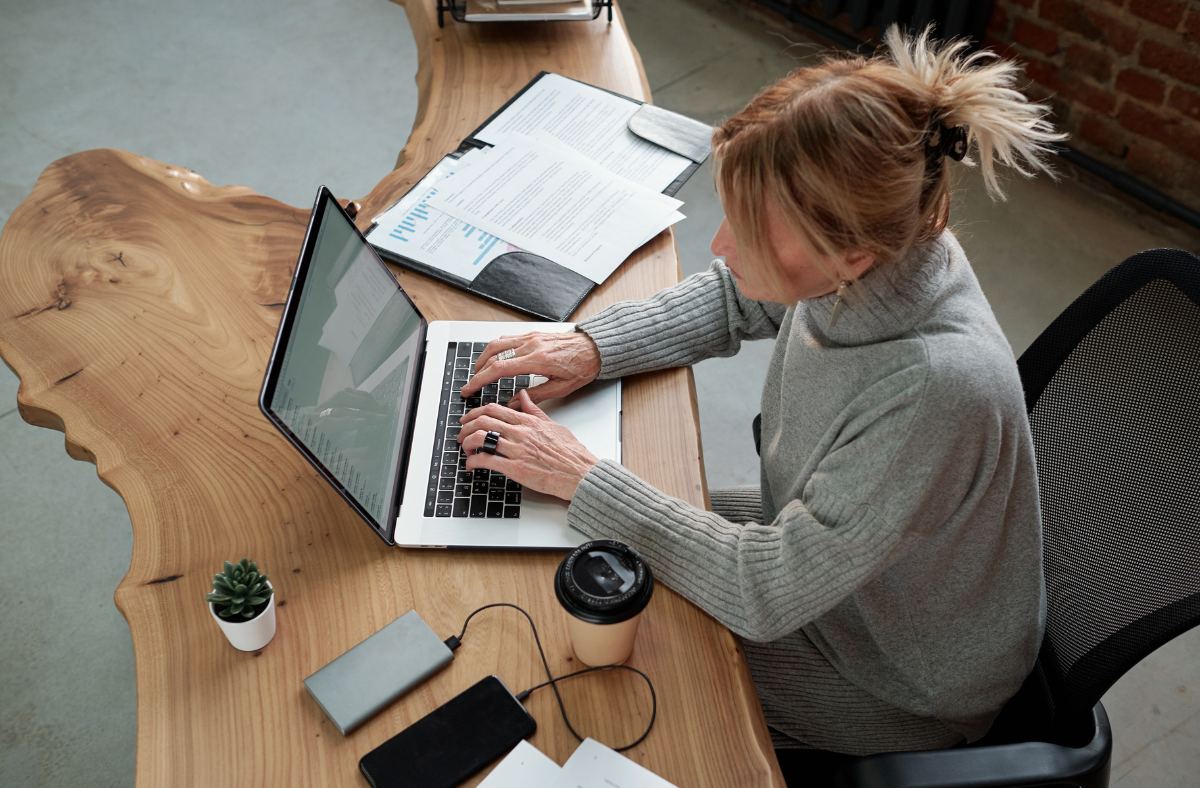 Person typing on a computer.